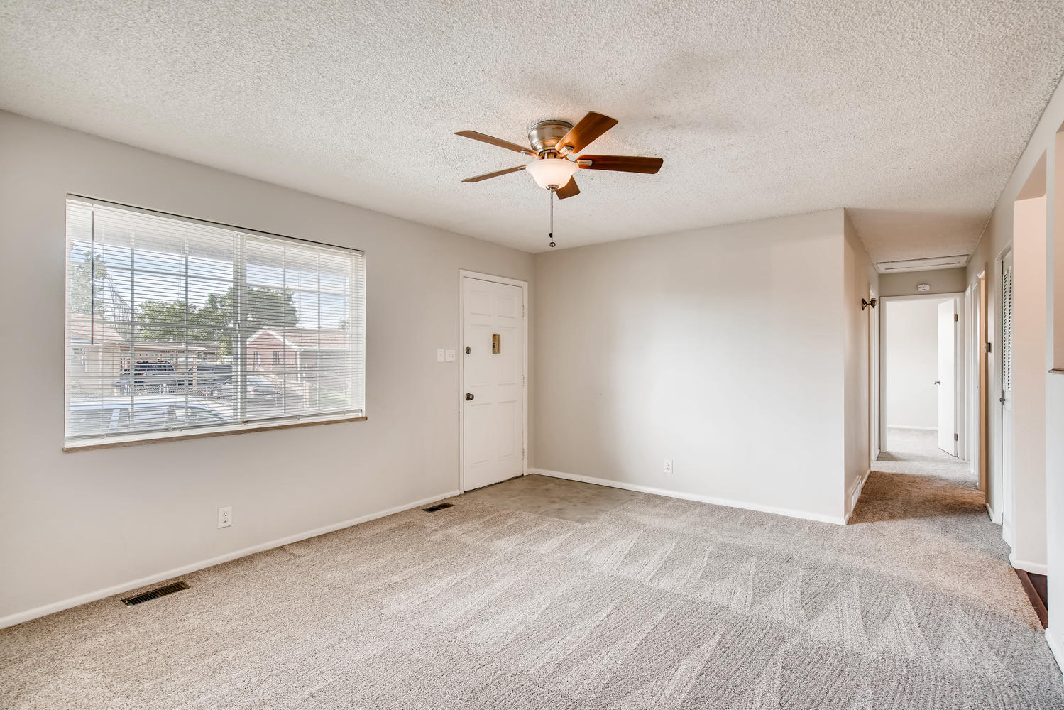 REAL ESTATE LISTING: 13040 Pensacola Place Denver Living Room