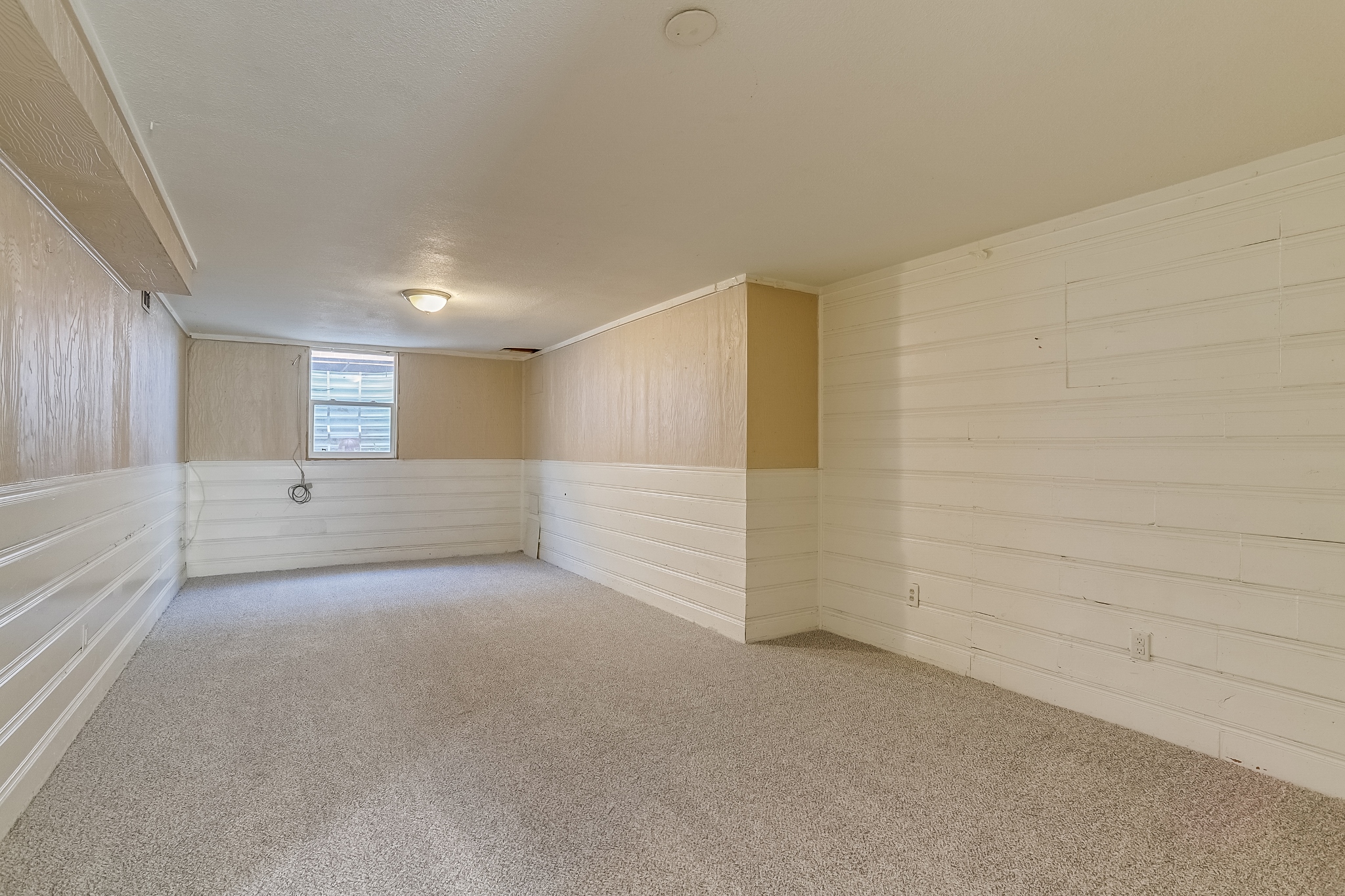 REAL ESTATE LISTING: 3685 Jasmine St Denver Basement Family Room